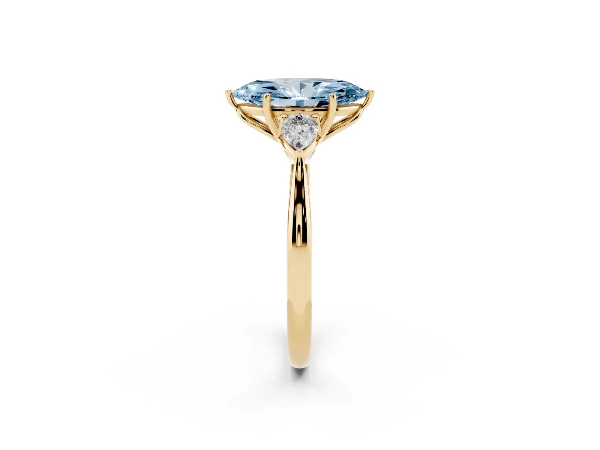 Fancy Blue Three-Stone Marquise Cut Diamond Ring with Pear Side Stones in Four-Prong Setting Yellow gold