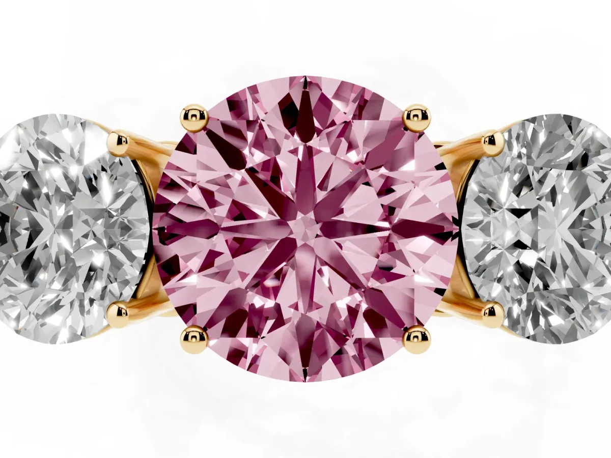 Fancy Pink Round Cut Diamond Three-Stone Ring with Prong Setting and Textured Band Yellow gold