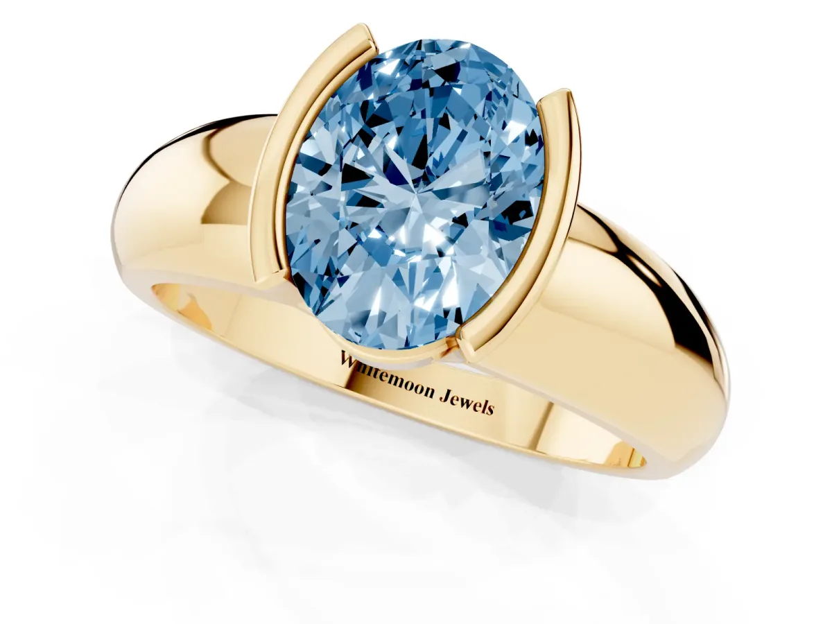 Fancy Blue Oval Cut Solitaire Tension Set Diamond Ring with Wide Band Yellow gold