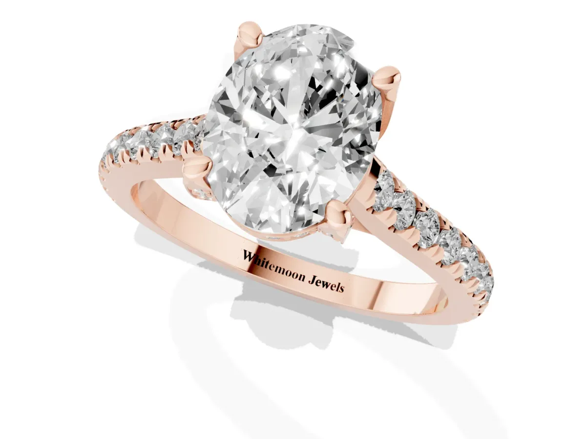 Oval Cut Brilliant Diamond Solitaire with Pavé Band and Four-Prong Setting Rose gold