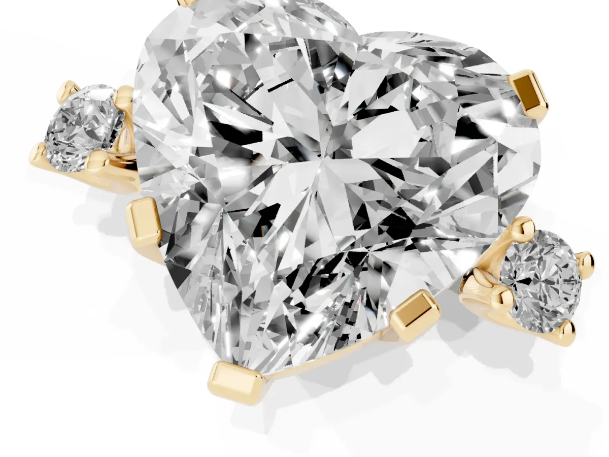 Heart Cut Cut Three-Stone Solitaire Ring with Round Accent Diamonds and Four-Prong Setting Yellow gold