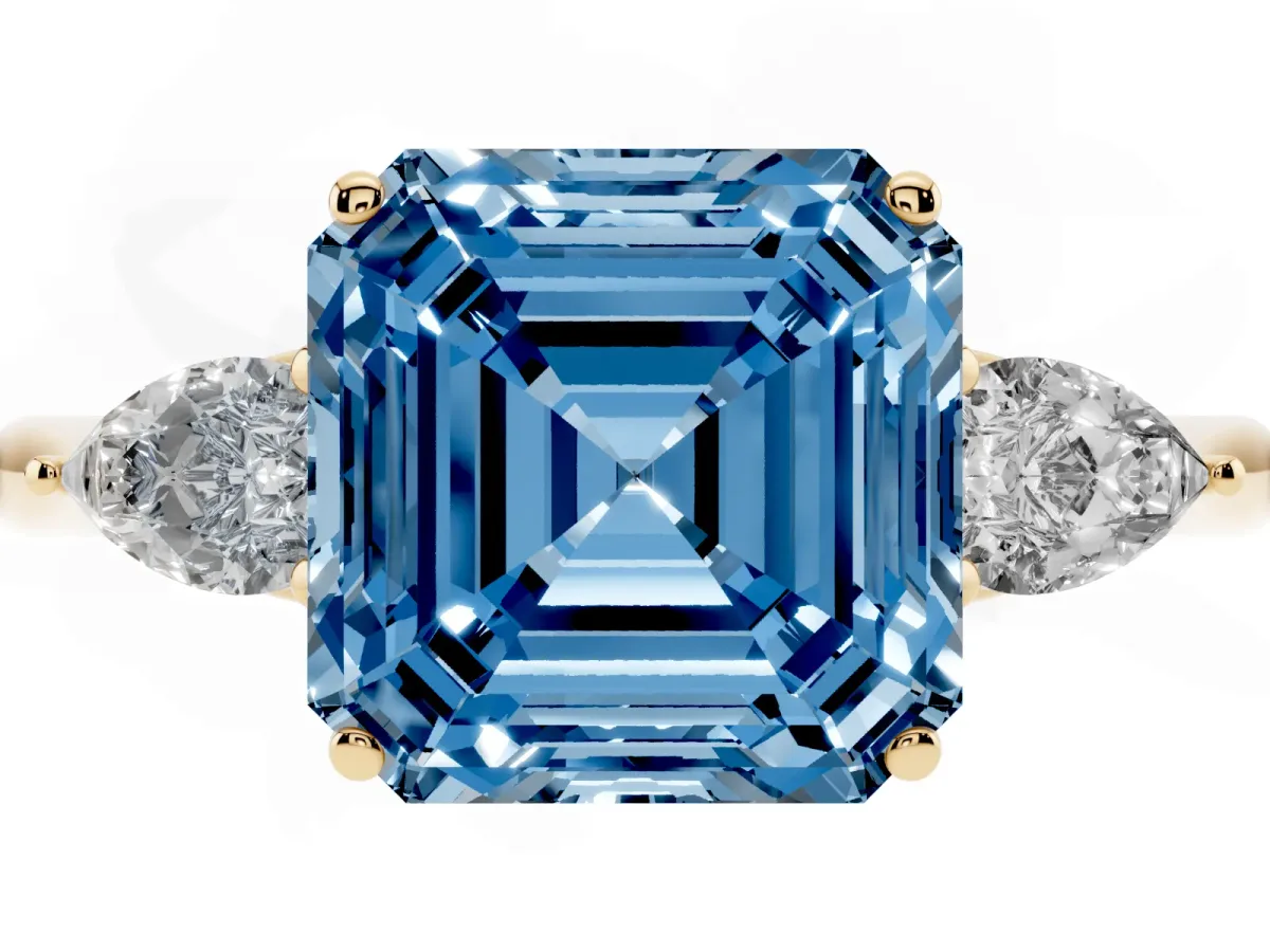 Fancy Blue Three-Stone Asscher Cut Diamond Ring with Pear Side Stones in Four-Prong Setting Yellow gold