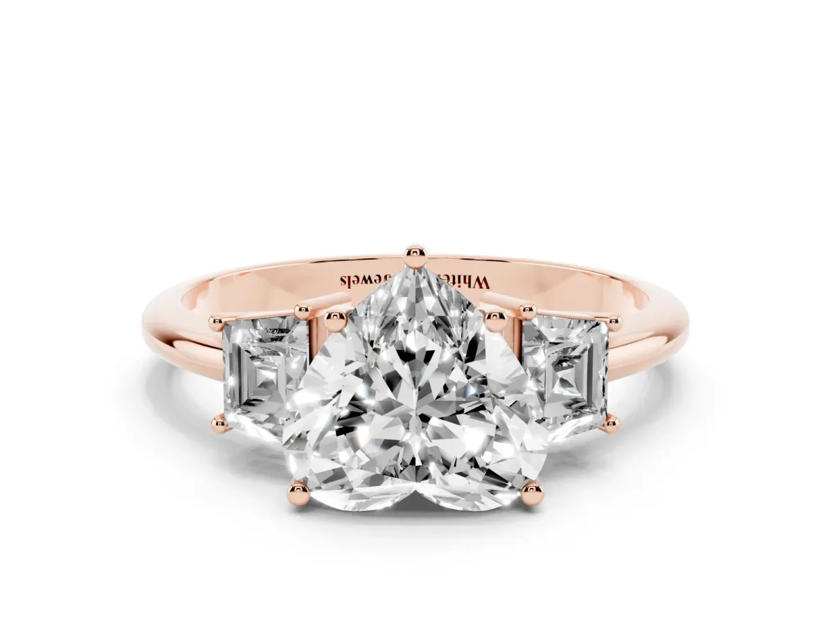 Heart Cut Diamond Three-Stone Ring with Trapezoid Side Stones and Prong Setting Rose gold