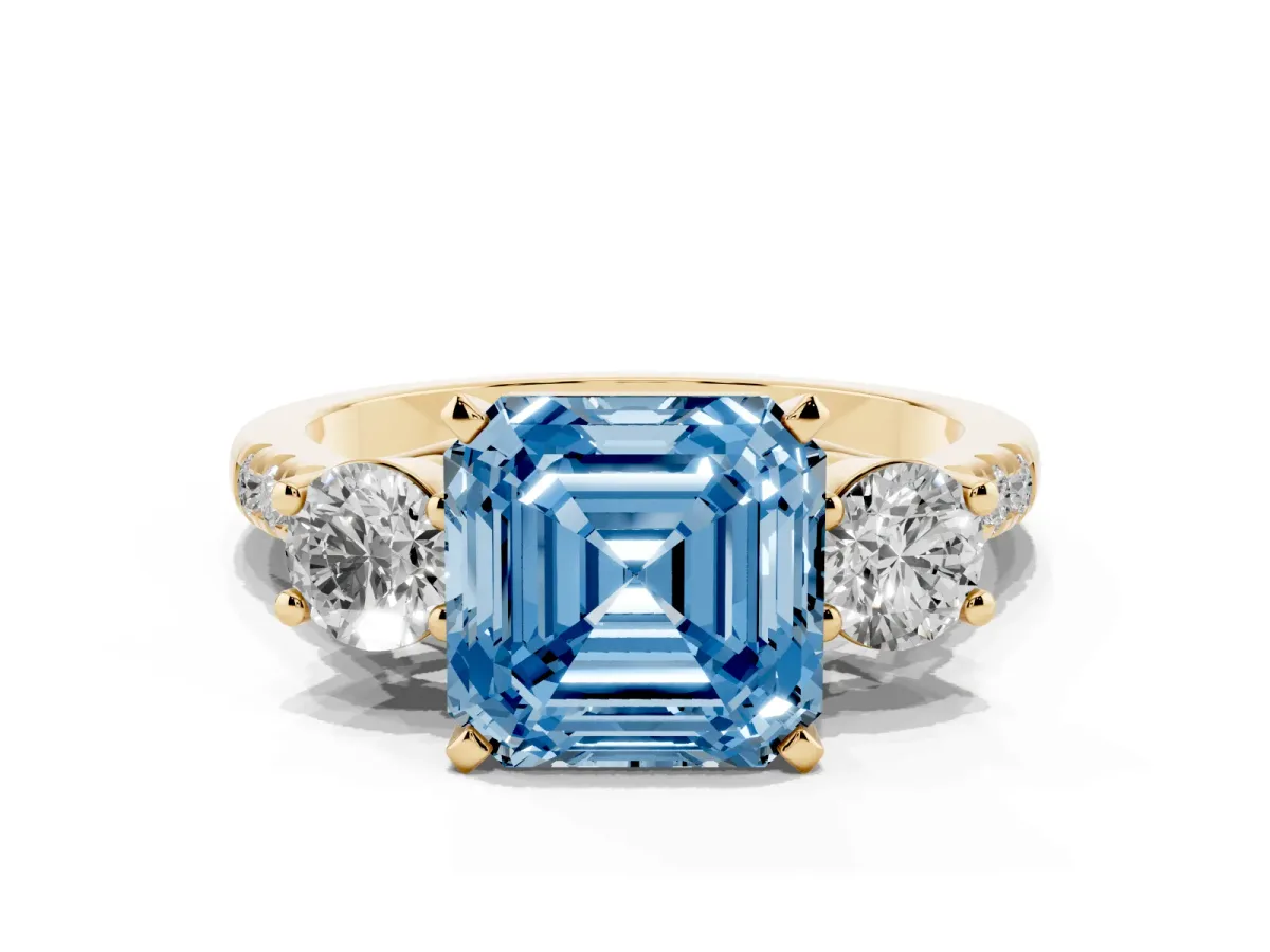 Fancy Blue Three-Stone Asscher Cut Diamond Pavé Band with Four-Prong Setting Yellow gold