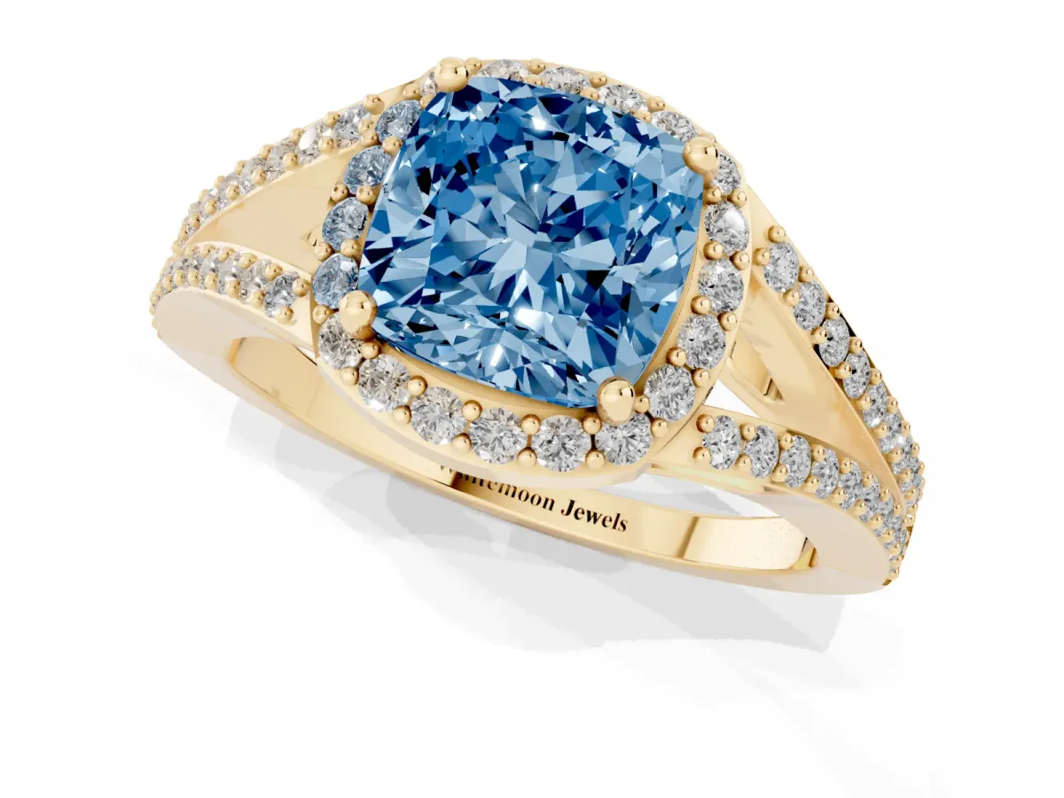 Fancy Blue Cushion Cut Halo Split Shank Pave Diamond Ring with Four-Prong Setting Yellow gold