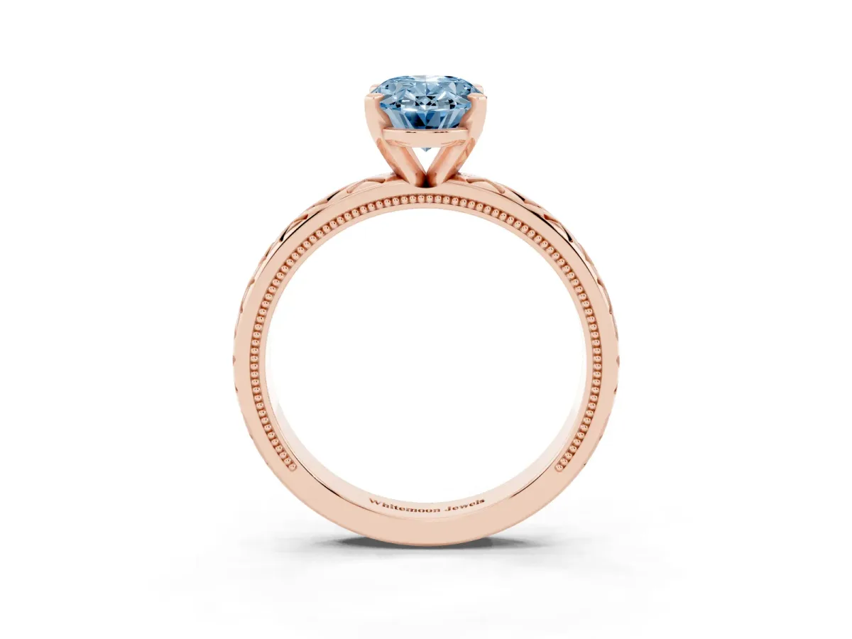 Fancy Blue Oval Cut Solitaire Diamond Ring with Milgrain and Black Enamel X Pattern Band Rose gold