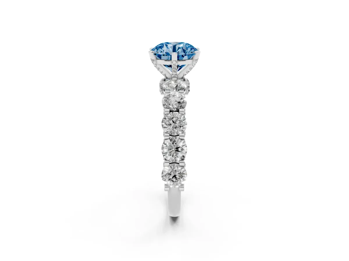 Fancy Blue Round Cut Diamond Side Stone Engagement Ring with Four-Prong Setting Silver