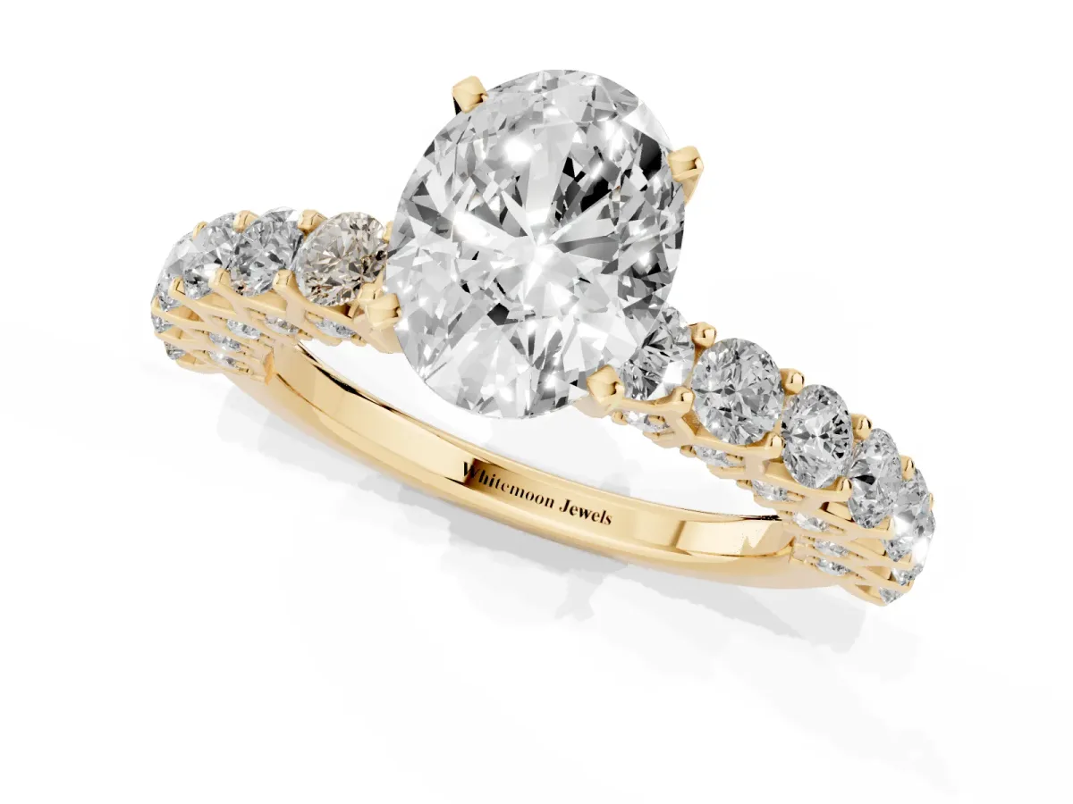 Oval Cut Diamond Solitaire Ring with Shared Prong Pavé Band and Four-Prong Setting Yellow gold