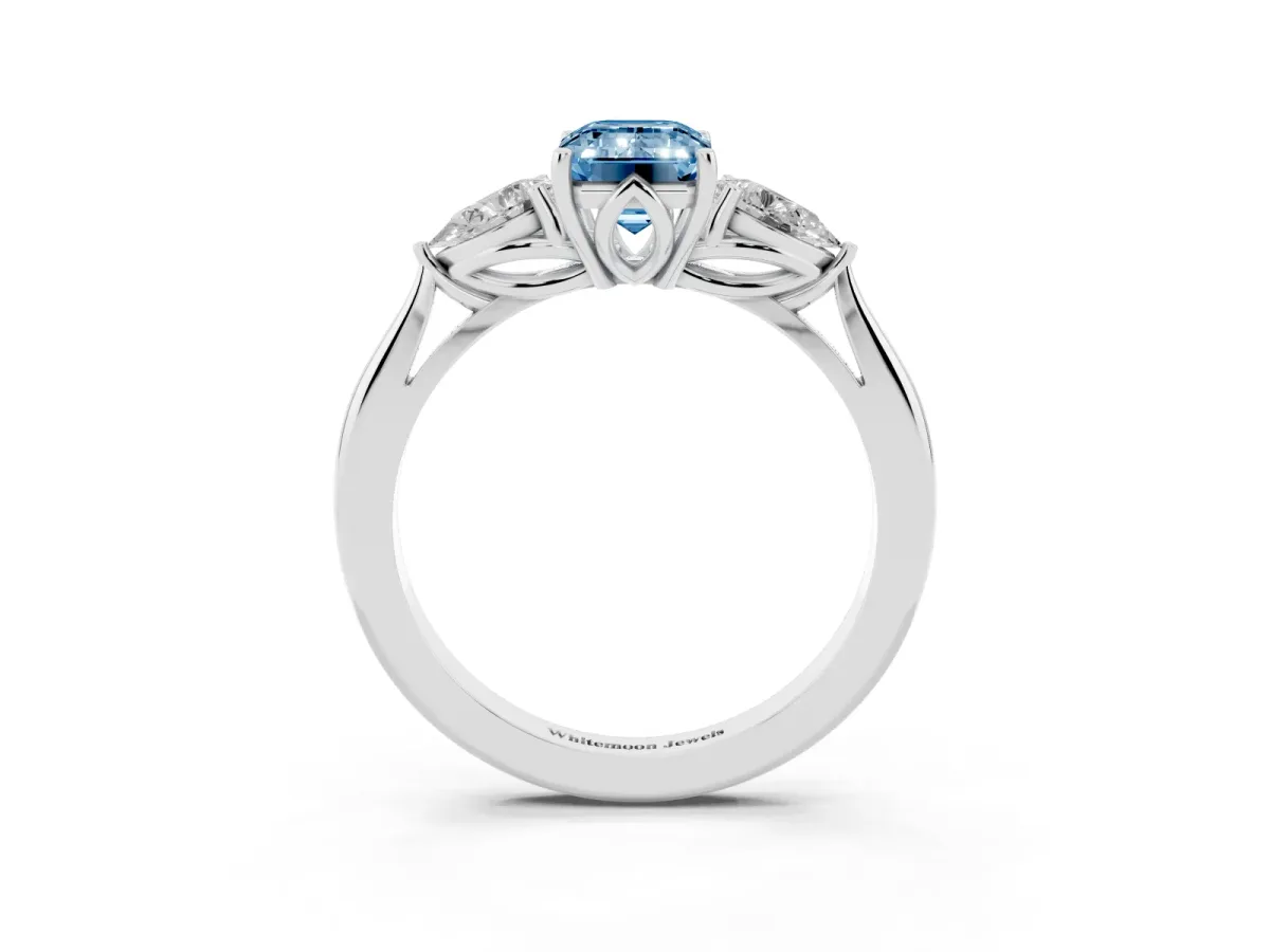Fancy Blue Three-Stone Emerald Cut Diamond Ring with Pear Side Stones in Four-Prong Setting Silver