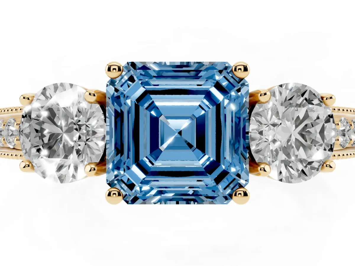 Fancy Blue Asscher Cut Three-Stone Diamond Ring with Pavé Band and Four-Prong Setting Yellow gold