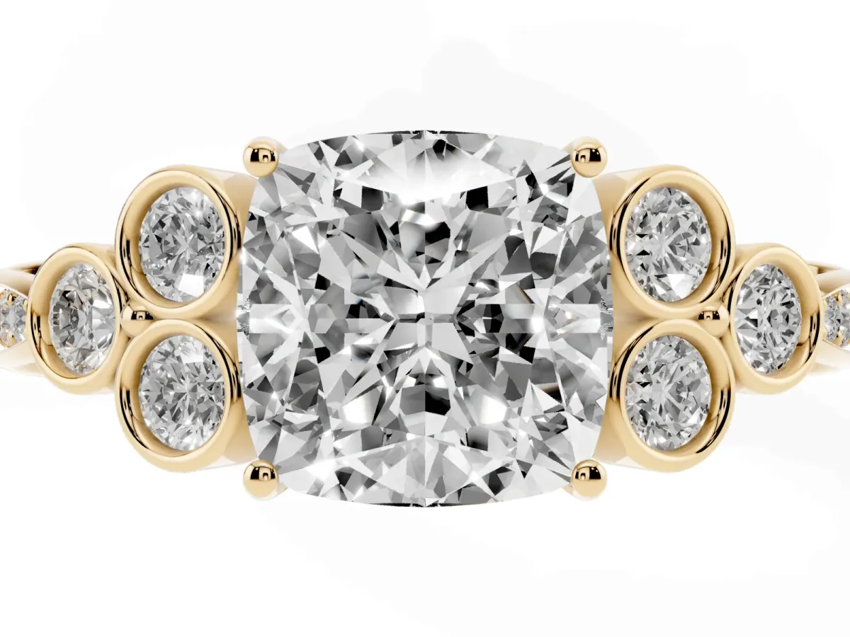 Cushion Cut Cut Diamond Engagement Ring with Bezel Set Round Side Stones and Prong Setting Yellow gold