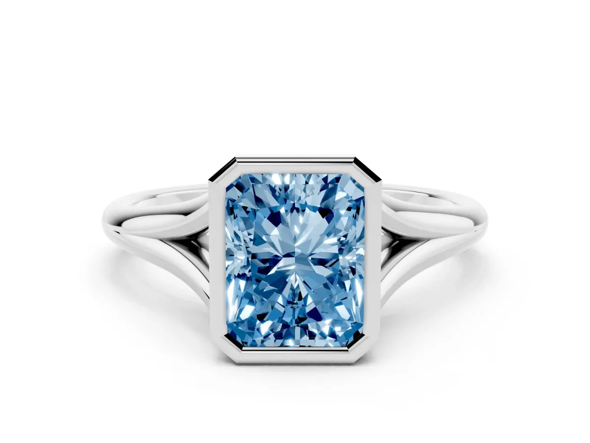Fancy Blue Bezel Set Radiant Cut Cut Solitaire Ring with Tapered Band Silver