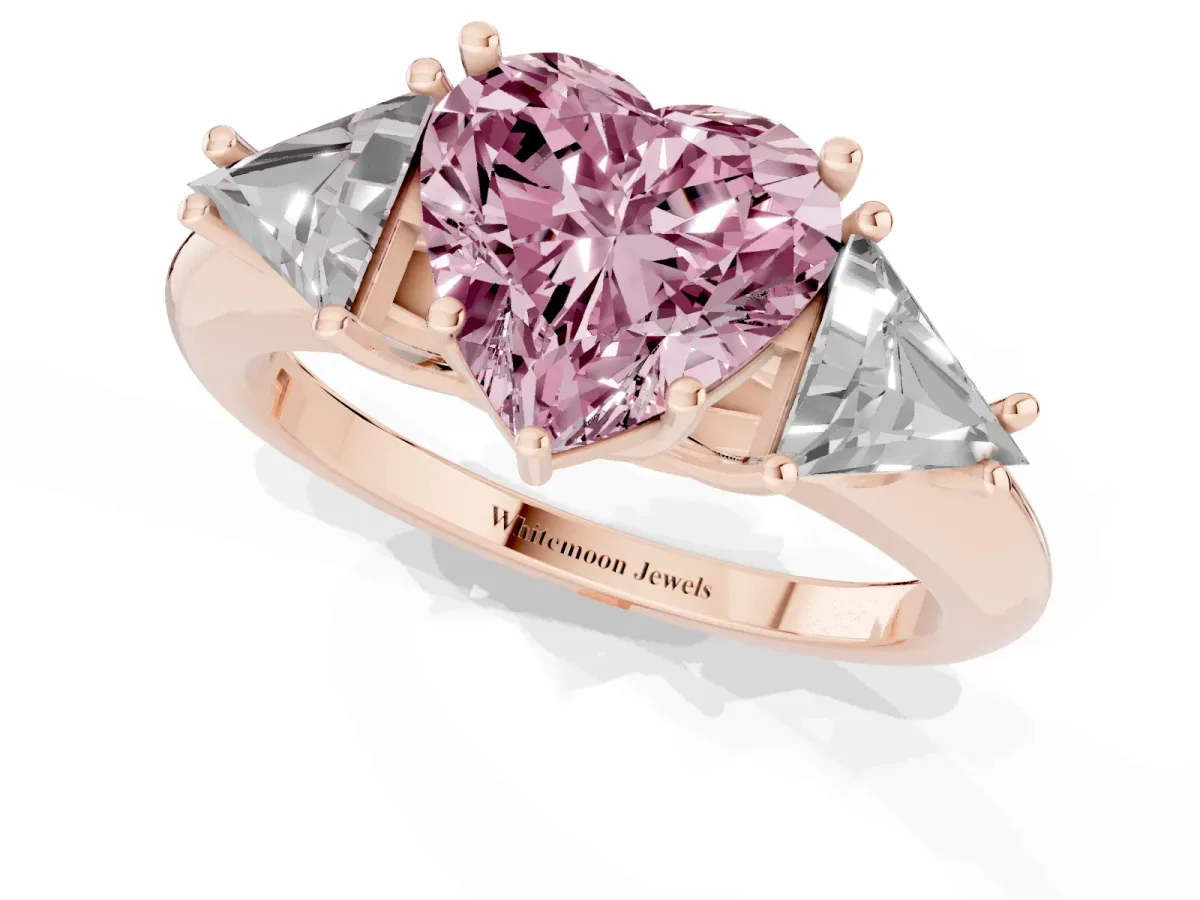 Fancy Pink Three-Stone Heart Cut Diamond Engagement Ring with Trillion Side Stones and Prong Setting Rose gold