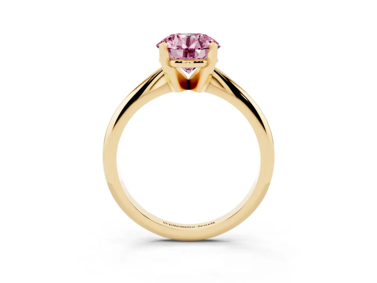 Fancy Pink Round Cut Cut Solitaire Ring with Four-Prong Setting on a Classic Band Yellow gold