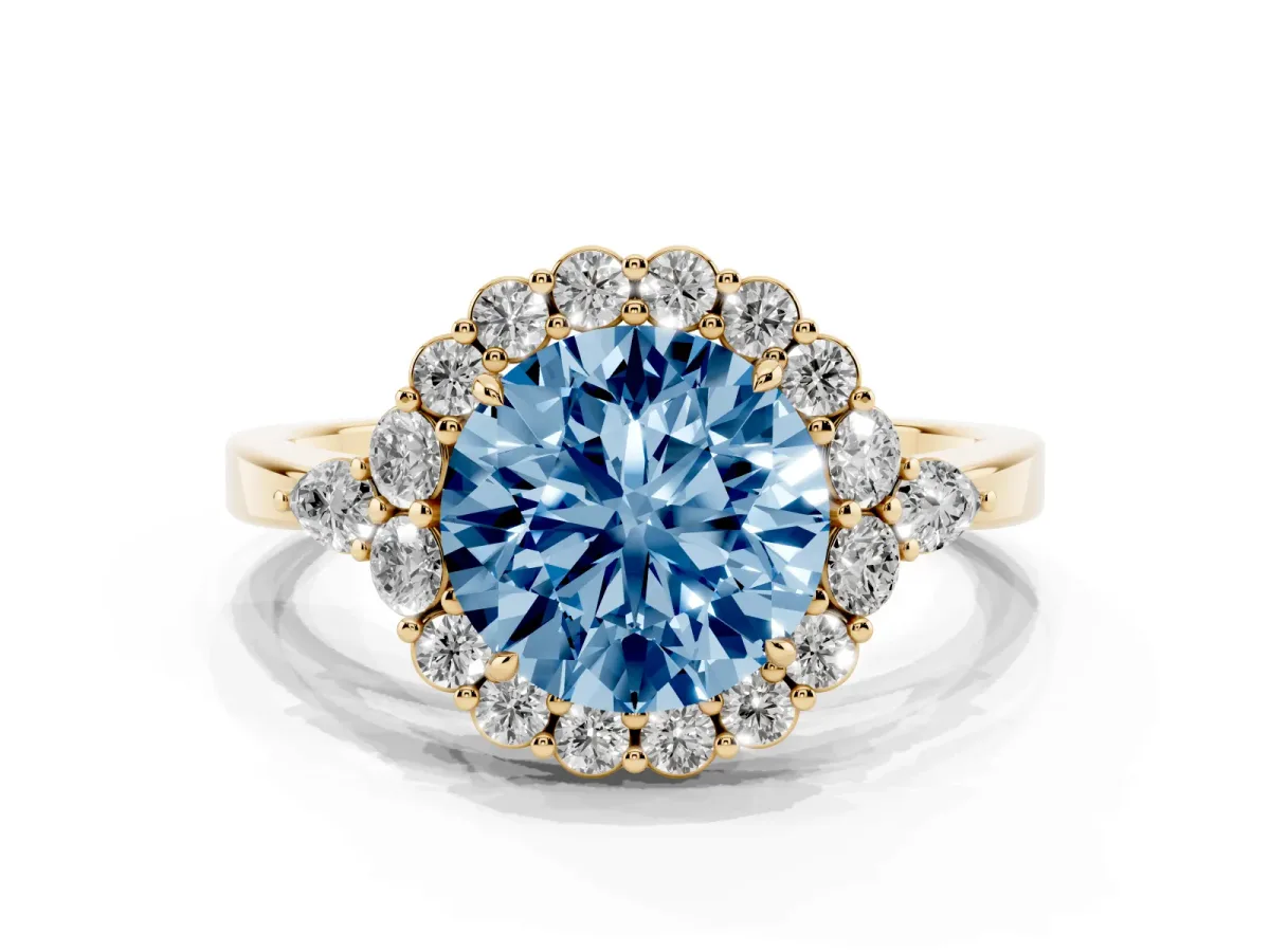 Fancy Blue Round Cut Diamond Halo Ring with Pear Side Stones and Prong Setting Yellow gold