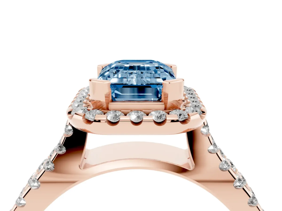 Fancy Blue Emerald Cut Diamond Halo Ring with Split Shank Pavé Band and Prong Setting Rose gold