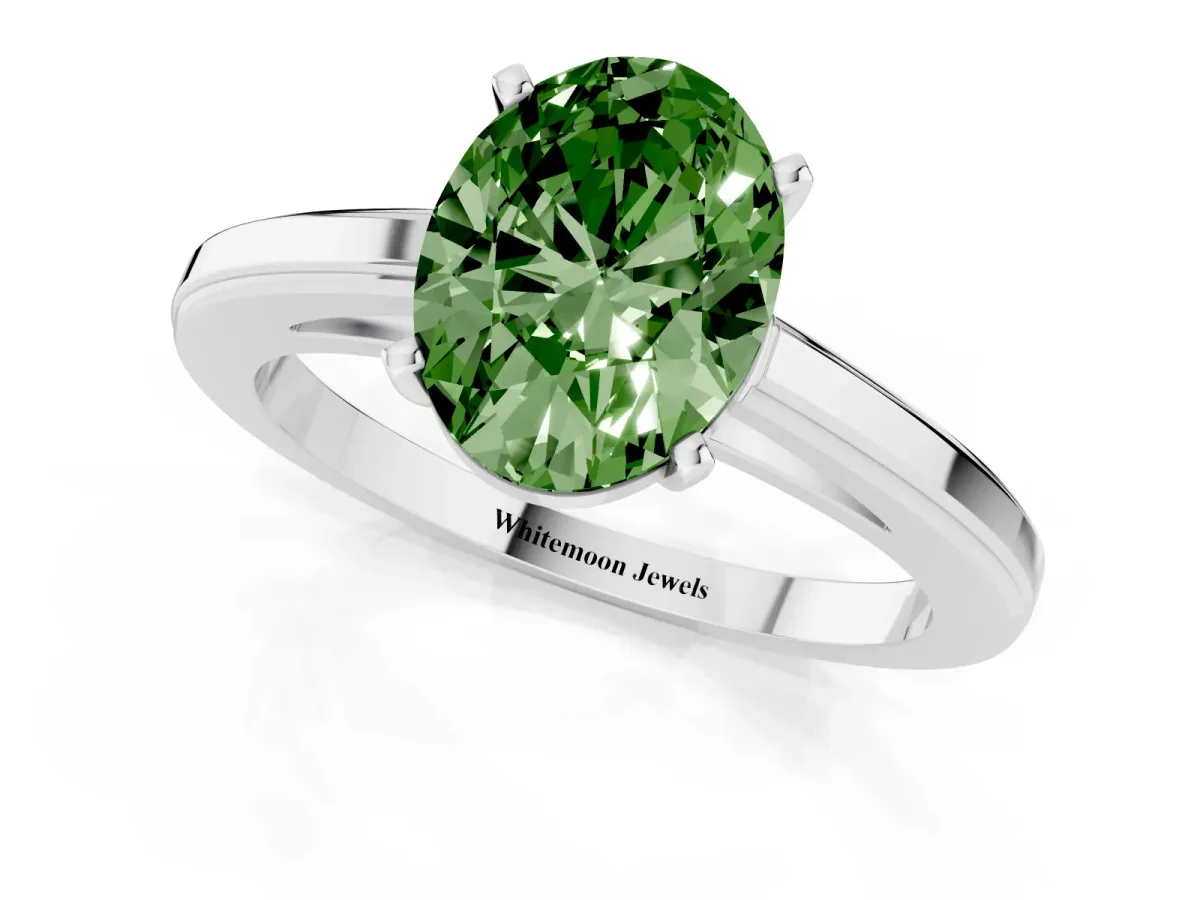 Fancy Green Oval Cut Solitaire Diamond Ring with Four-Prong Setting and Classic Band Silver