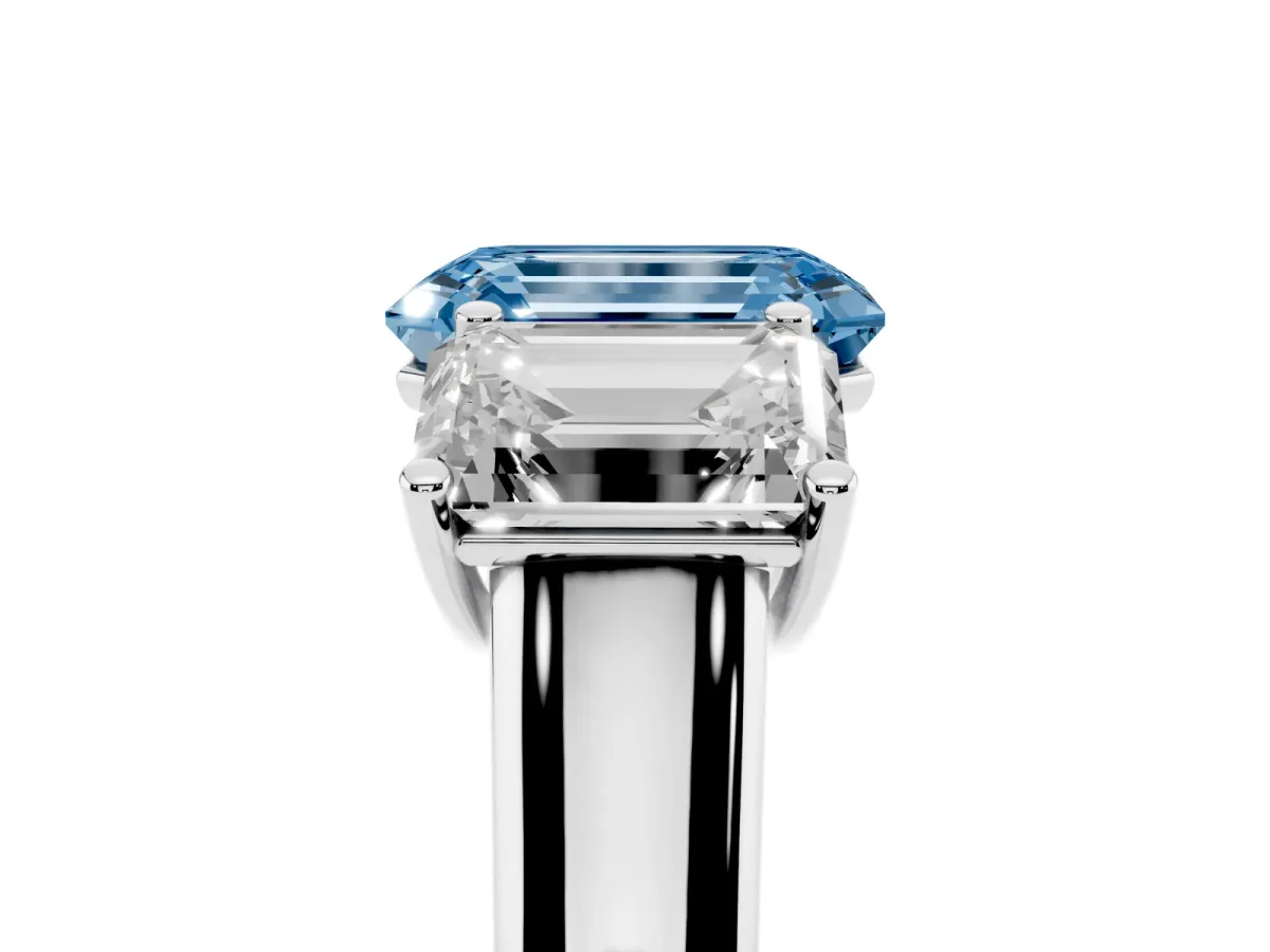 Fancy Blue Emerald Cut Three-Stone Diamond Ring with Prong Setting on a Classic Band Silver
