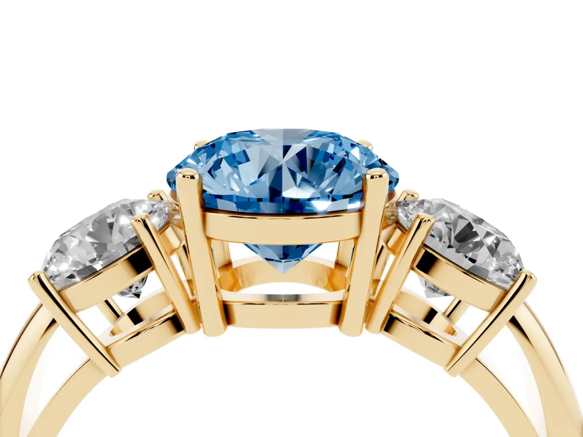 Fancy Blue Three-Stone Round Cut Cut Diamond Engagement Ring with Prong Setting on a White Gold Band Yellow gold