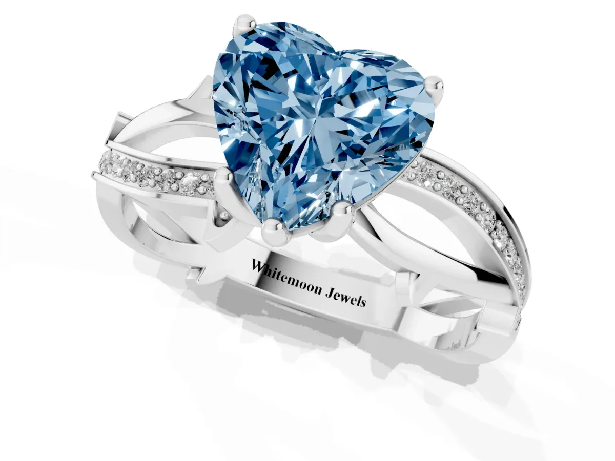 Fancy Blue Heart Cut Solitaire Twist Band with Pavé Accents and Four-Prong Setting Silver
