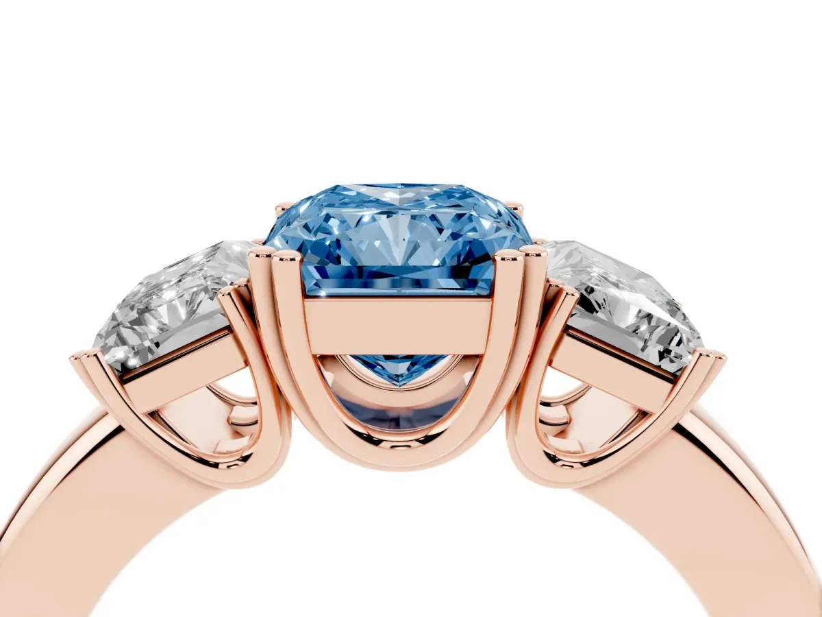 Fancy Blue Three-Stone Radiant Cut Cut Diamond Ring with Channel Set Band and Four-Prong Setting Rose gold