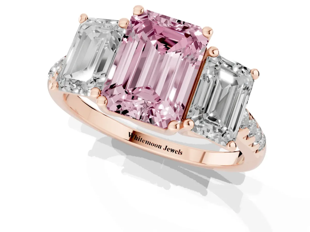 Fancy Pink Three-Stone Emerald Cut Diamond Ring with Round Pavé Band and Prong Setting Rose gold