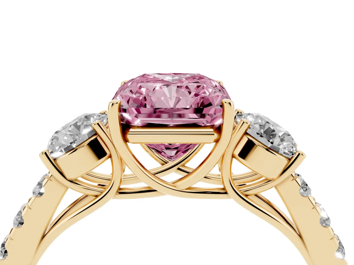 Fancy Pink Radiant Cut Cut Diamond Three-Stone Ring with Round Side Stones and Pavé Band Yellow gold