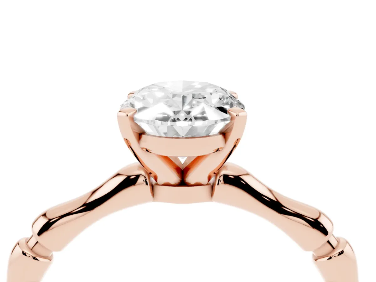 Oval Cut Solitaire Diamond Ring with Bamboo Band and Four-Prong Setting Rose gold