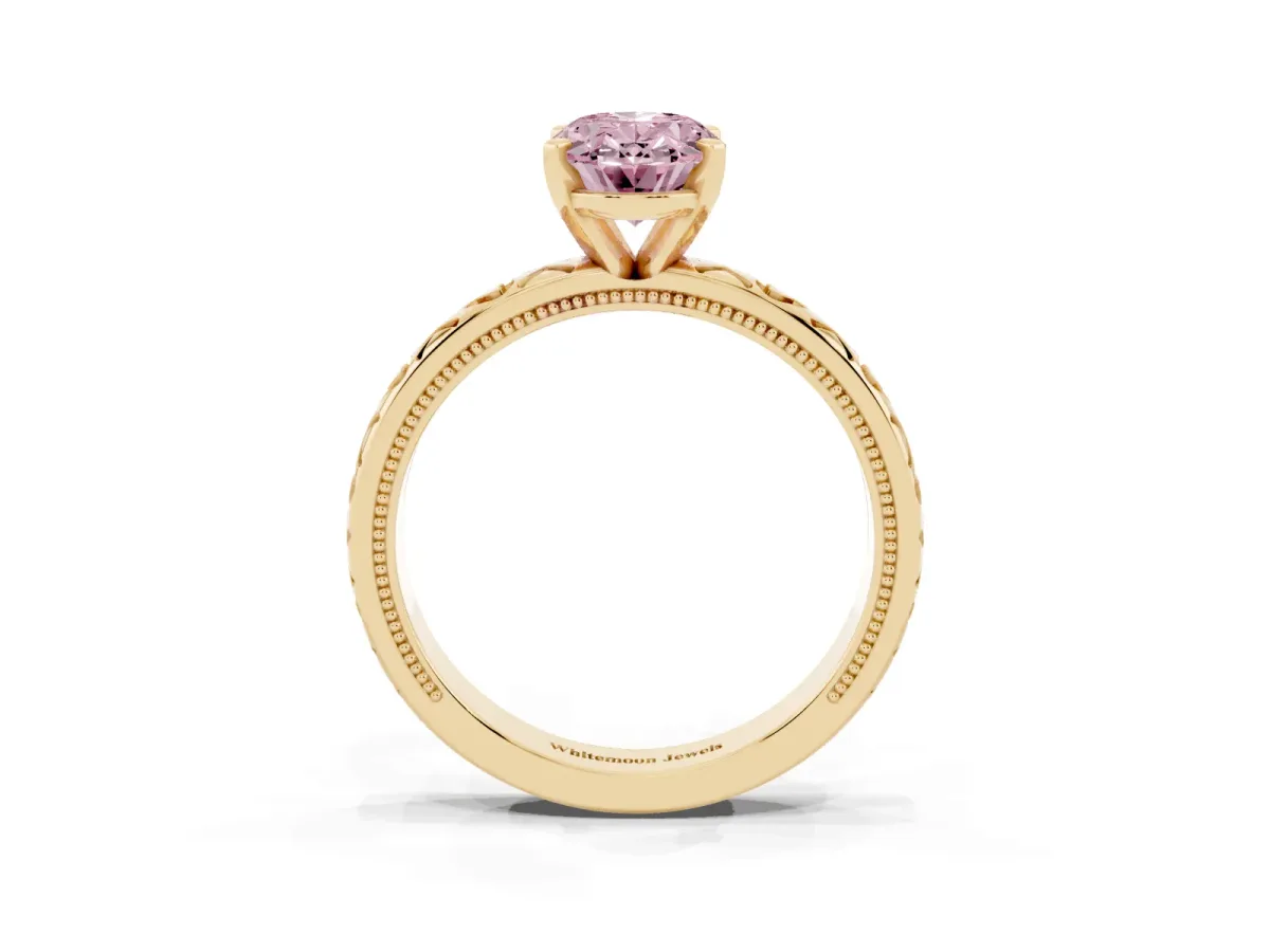 Fancy Pink Oval Cut Solitaire Diamond Engagement Ring with XO Engraved Band and Four-Prong Setting Yellow gold