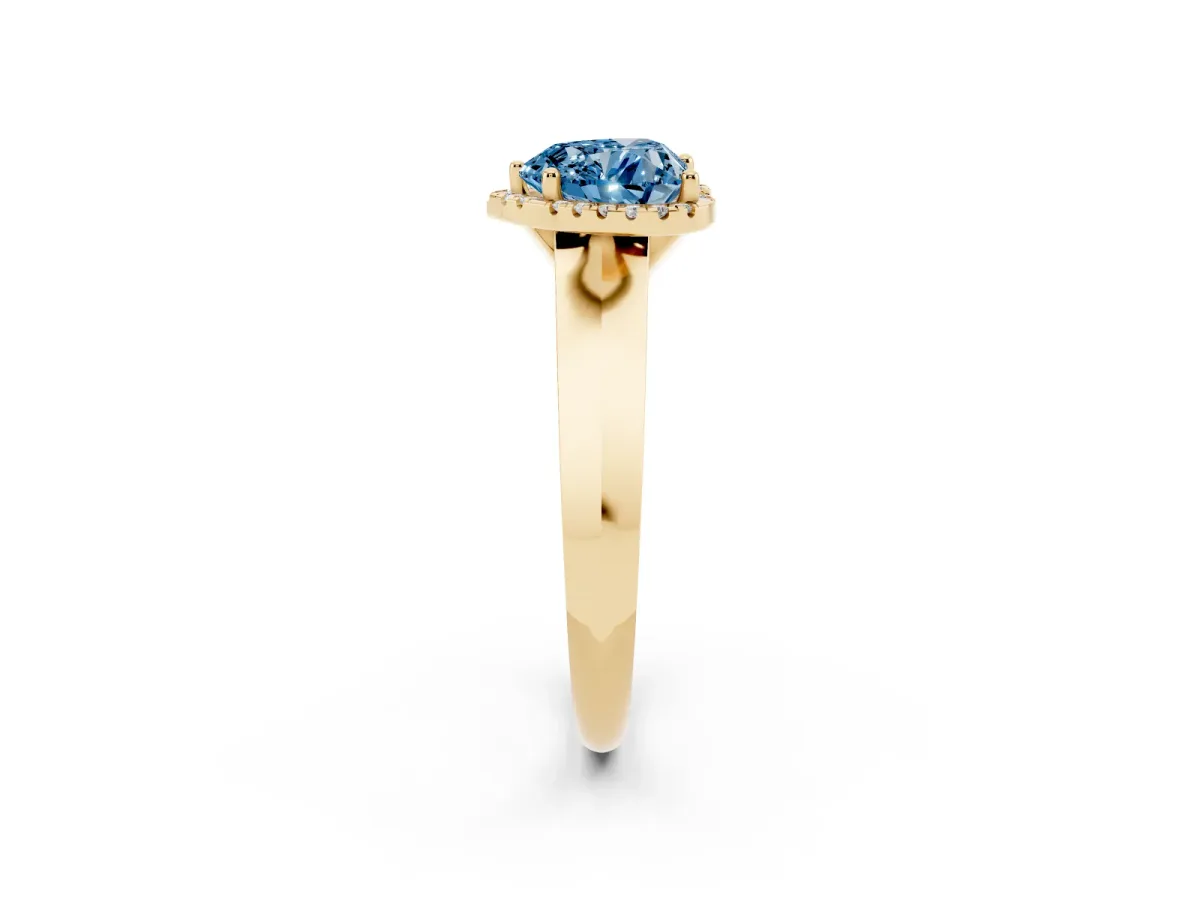 Fancy Blue Heart Cut Halo Diamond Ring with Cathedral Band and Four-Prong Setting Yellow gold