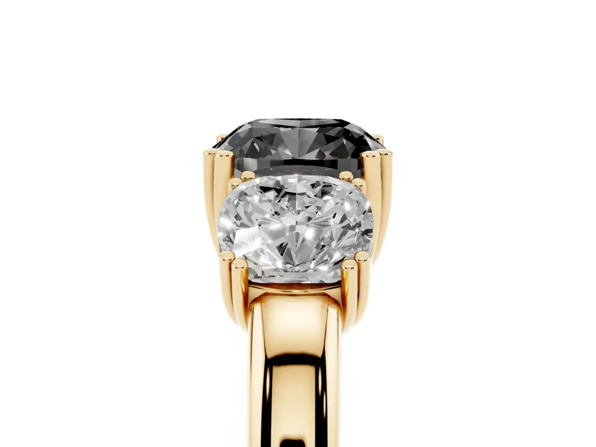 Fancy Black Three-Stone Cushion Cut Cut Diamond Ring with Channel Set Band and Four-Prong Setting Yellow gold