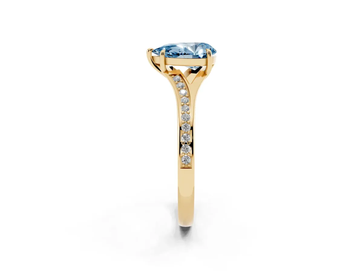 Fancy Blue Pear Cut Diamond Solitaire Ring with Pavé Band and Prong Setting Yellow gold
