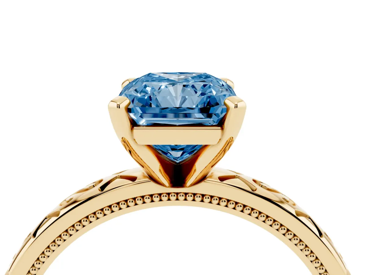 Fancy Blue Radiant Cut Solitaire Engagement Ring with Scrollwork Band and Four-Prong Setting Yellow gold