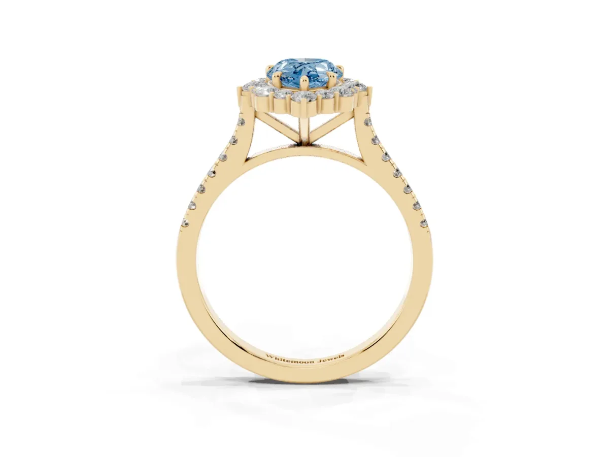Fancy Blue Pear Cut Halo Diamond Ring with Pavé Band and Prong Setting Yellow gold