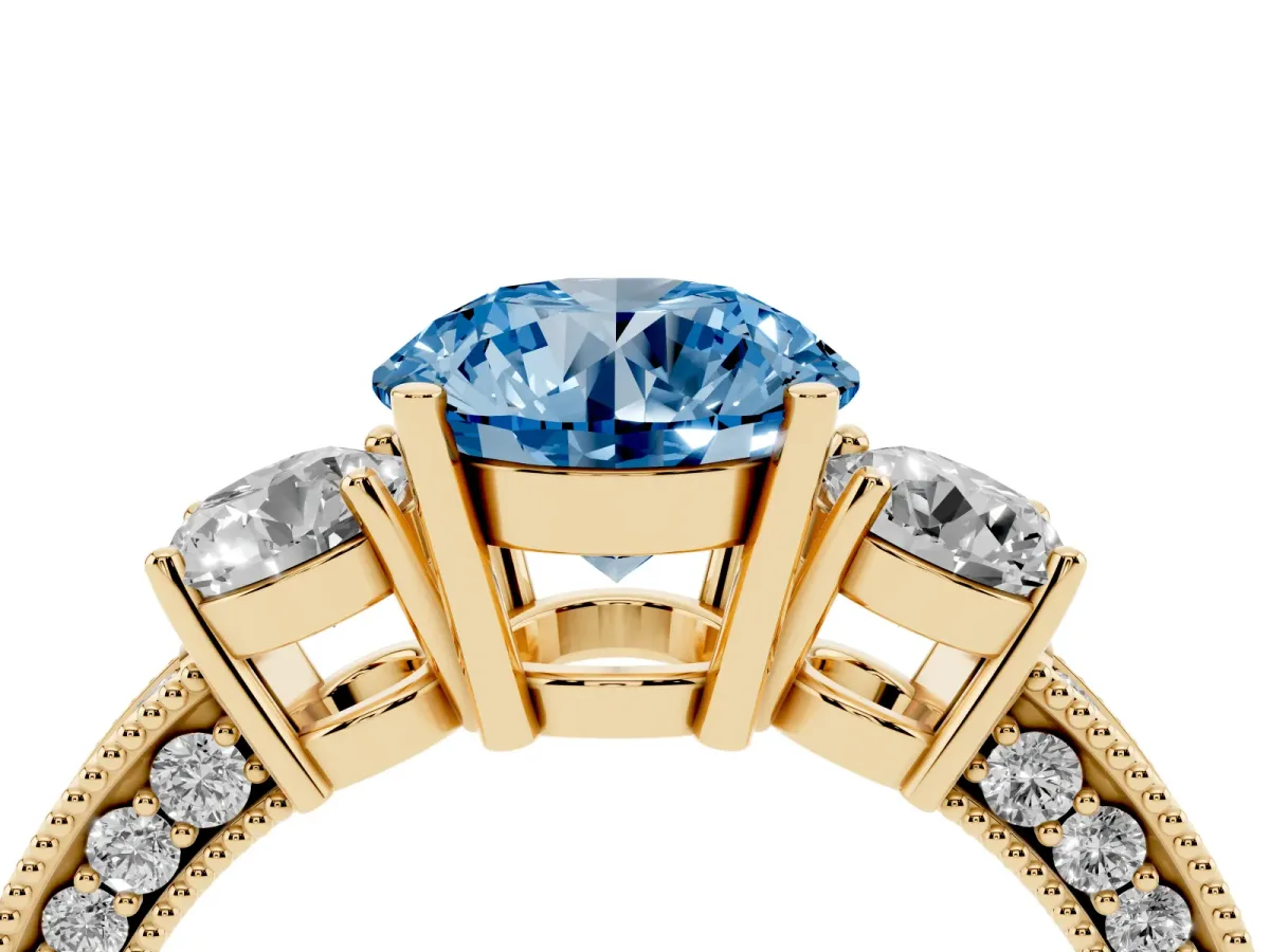 Fancy Blue Round Cut Three-Stone Diamond Ring with Pavé Band and Four-Prong Setting Yellow gold