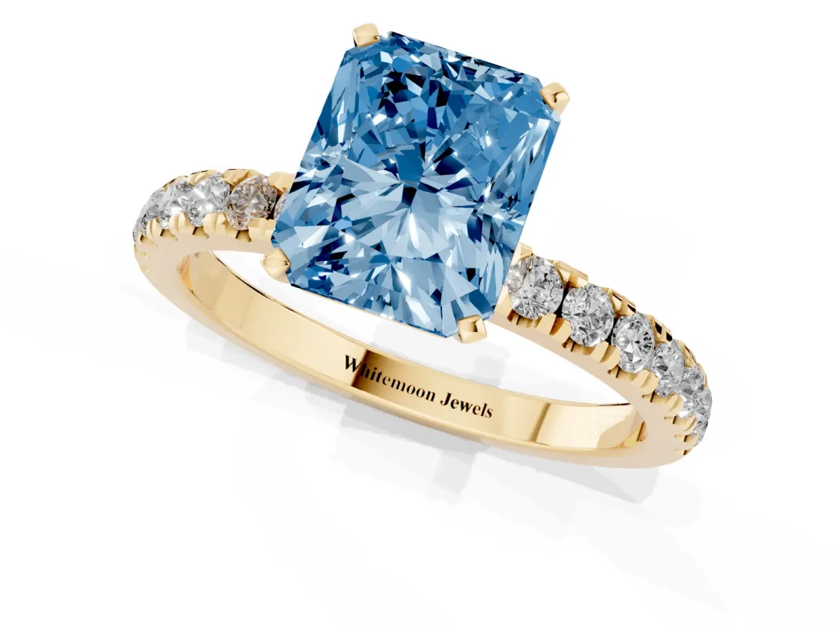 Fancy Blue Radiant Cut Diamond Solitaire Ring with Pavé Accents and Four-Prong Setting Yellow gold