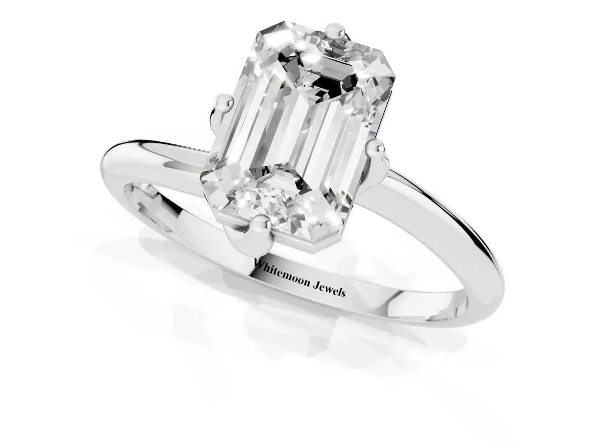 Emerald Cut Diamond Solitaire Engagement Ring with Four-Prong Setting and Classic Band Silver