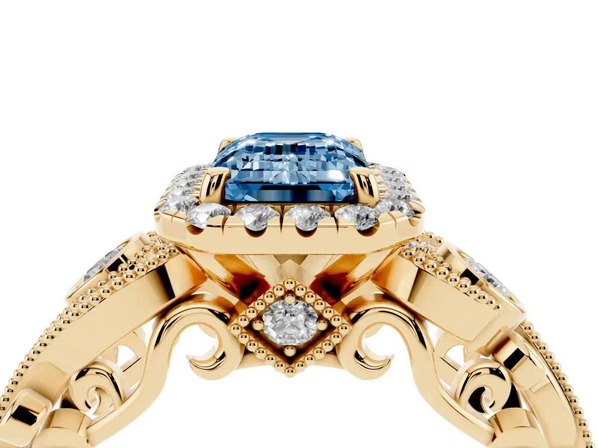 Fancy Blue Emerald Cut Diamond Halo Ring with Milgrain Pavé Band and Four-Prong Setting Yellow gold