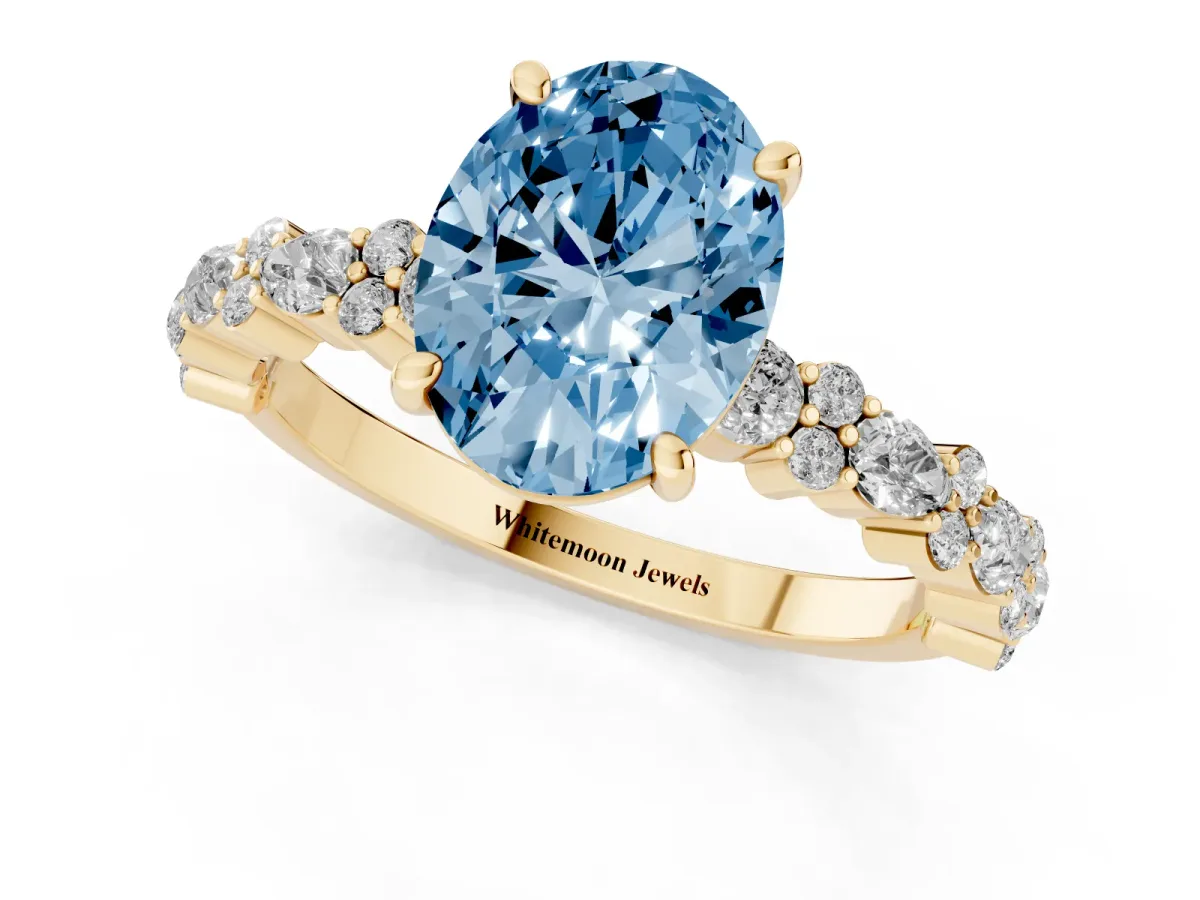 Fancy Blue Oval Cut Diamond Side Stone Solitaire Ring with Round and Four-Prong Setting Yellow gold