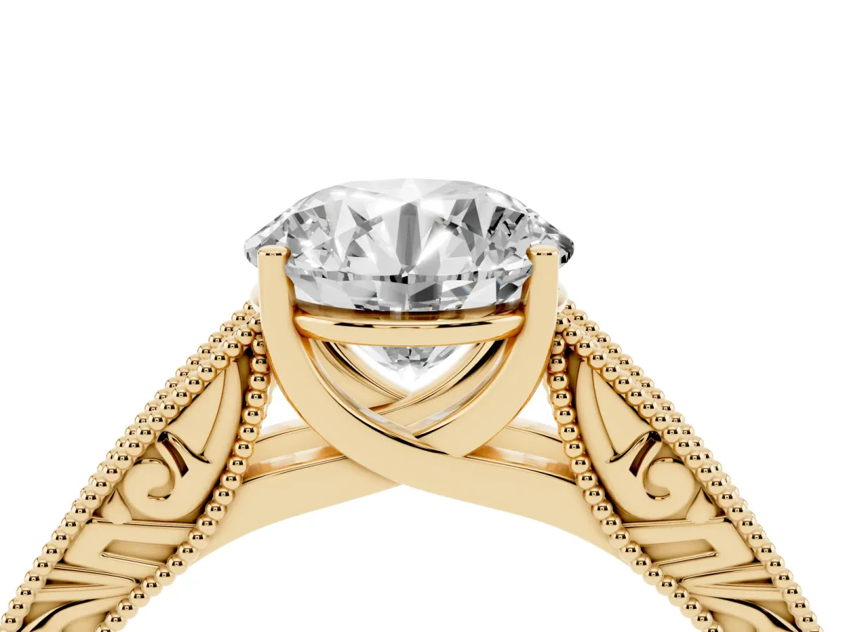 Round Cut Diamond Solitaire Ring with Engraved Band and Four-Prong Setting Yellow gold