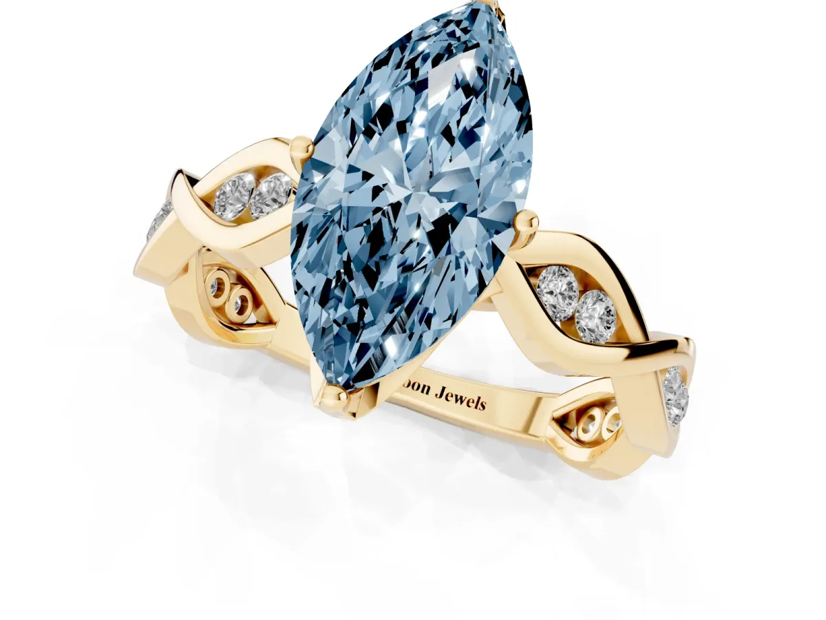 Fancy Blue Marquise Cut Solitaire Twist Band with Leaf Prong Setting Yellow gold