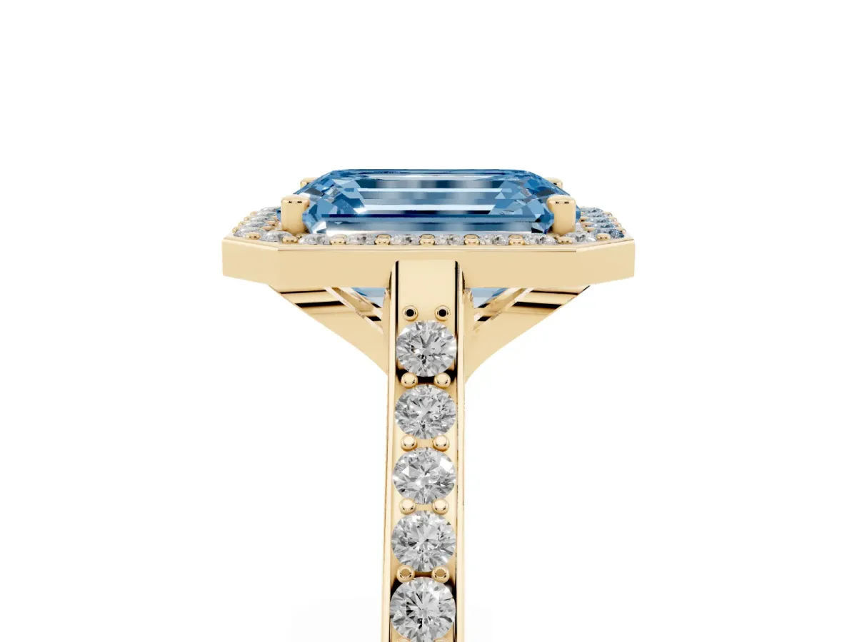 Fancy Blue Emerald Cut Diamond Halo Engagement Ring with Round Pavé Shoulders and Prong Setting Yellow gold