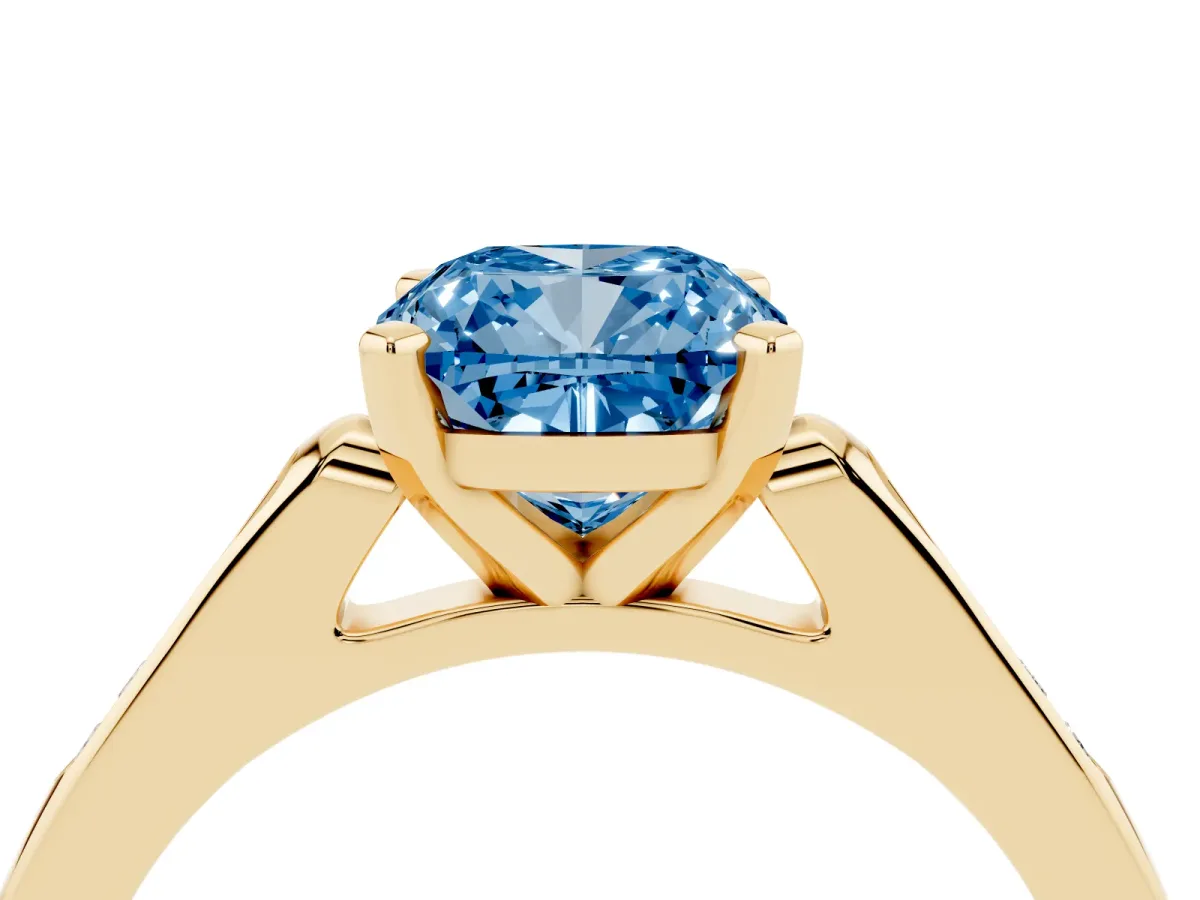 Fancy Blue Cushion Cut Diamond Solitaire Ring with Channel Set Round Band and Prong Setting Yellow gold