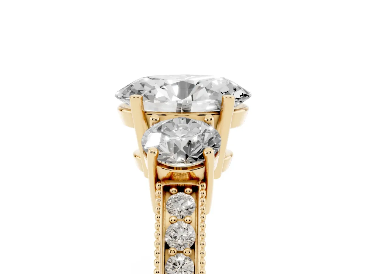 Oval Cut Three-Stone Diamond Ring with Pavé Band and Four-Prong Setting Yellow gold