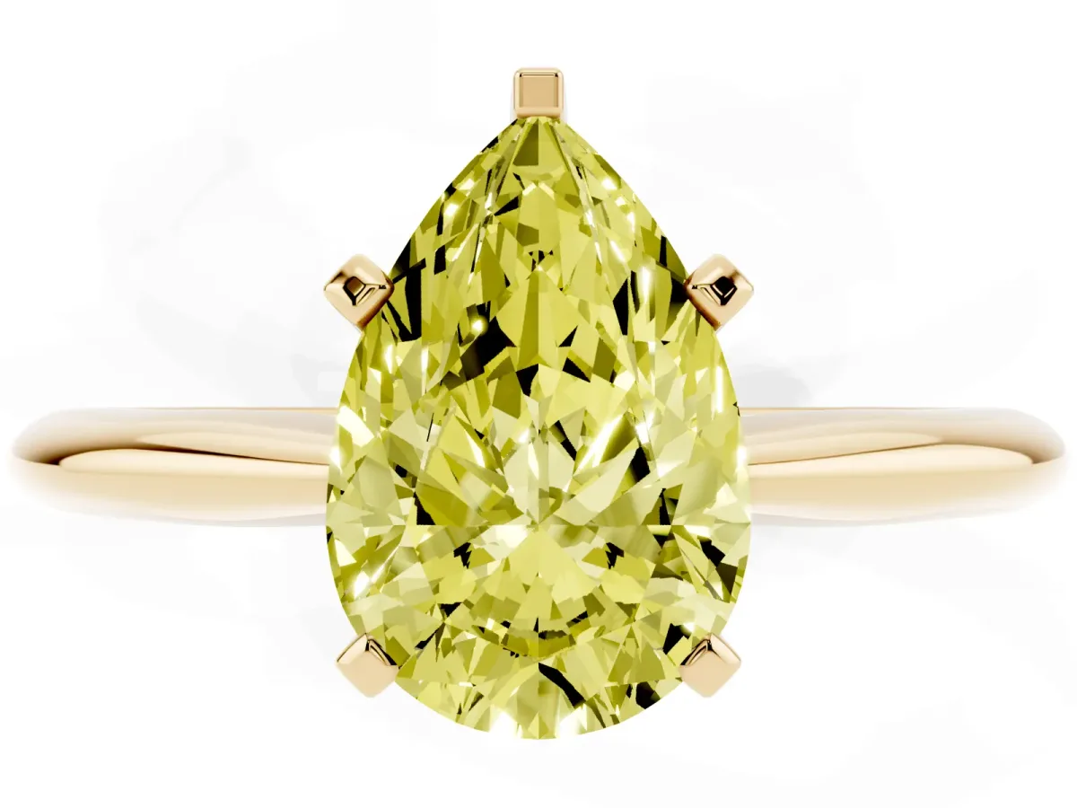Fancy Yellow Pear Cut Cut Solitaire Ring with Four-Prong Setting on a Classic Band Yellow gold
