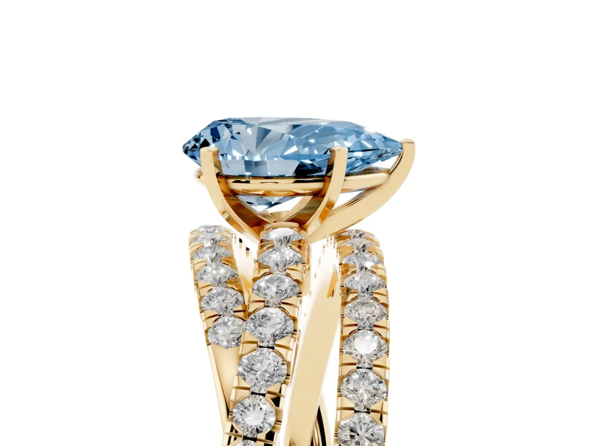 Fancy Blue Pear Cut Solitaire Twist Band with Pavé Setting and Four-Prong Setting Yellow gold