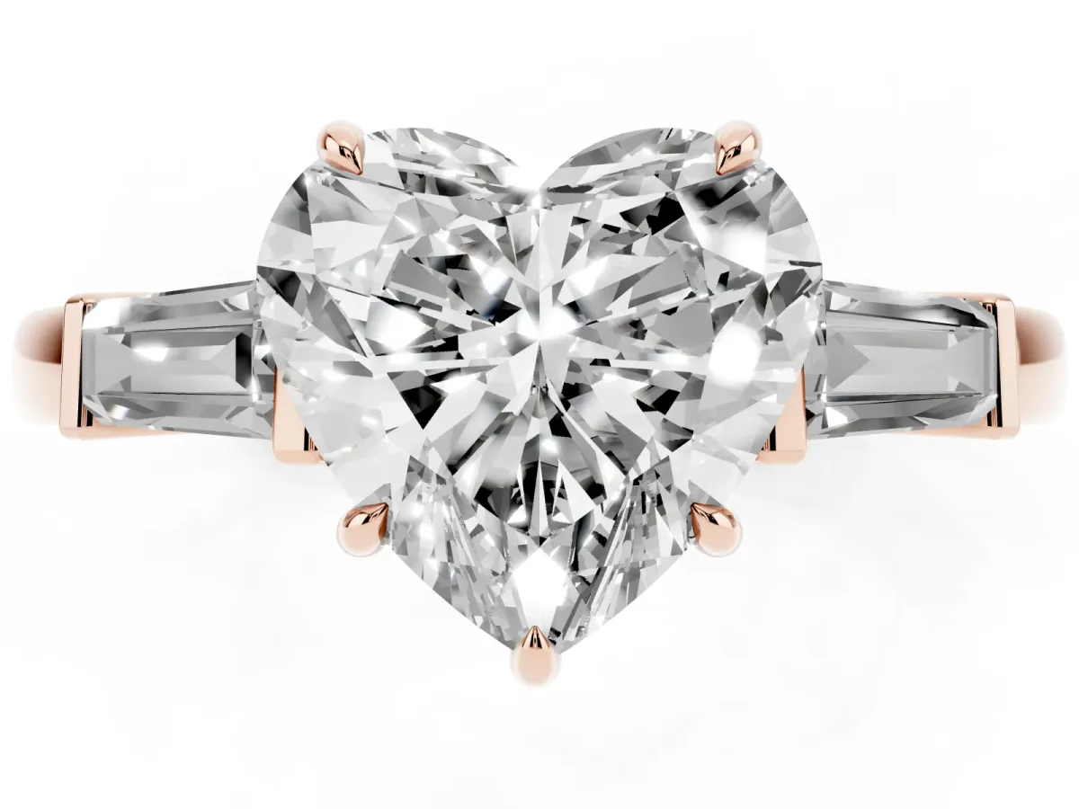 Heart Cut Diamond Three-Stone Ring with Tapered Baguette Side Stones and Prong Setting Rose gold