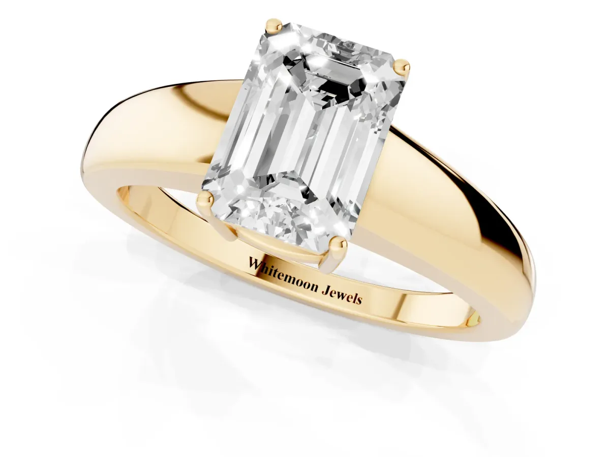 Emerald Cut Solitaire Diamond Ring with Tapered Band and Four-Prong Setting Yellow gold