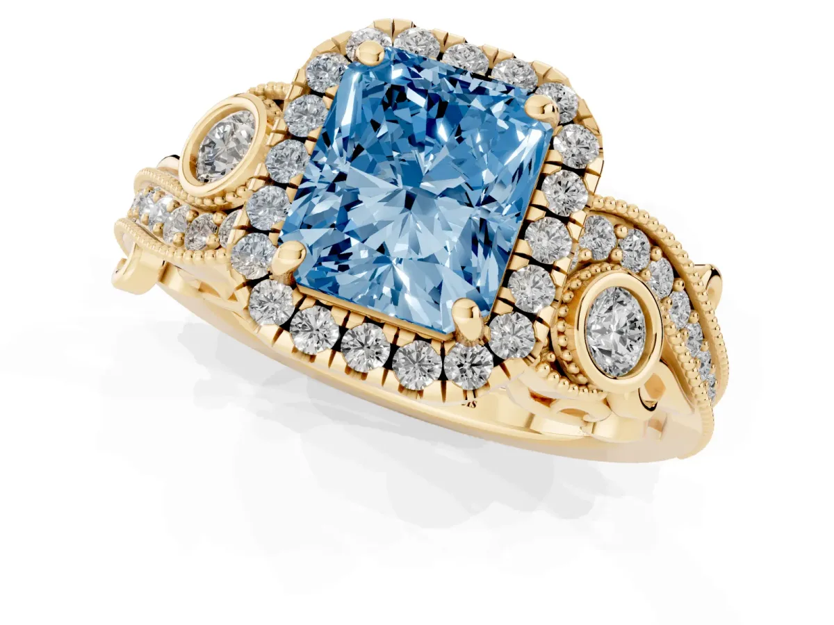 Fancy Blue Radiant Cut Diamond Halo Ring with Milgrain Pavé Band and Four-Prong Setting Yellow gold