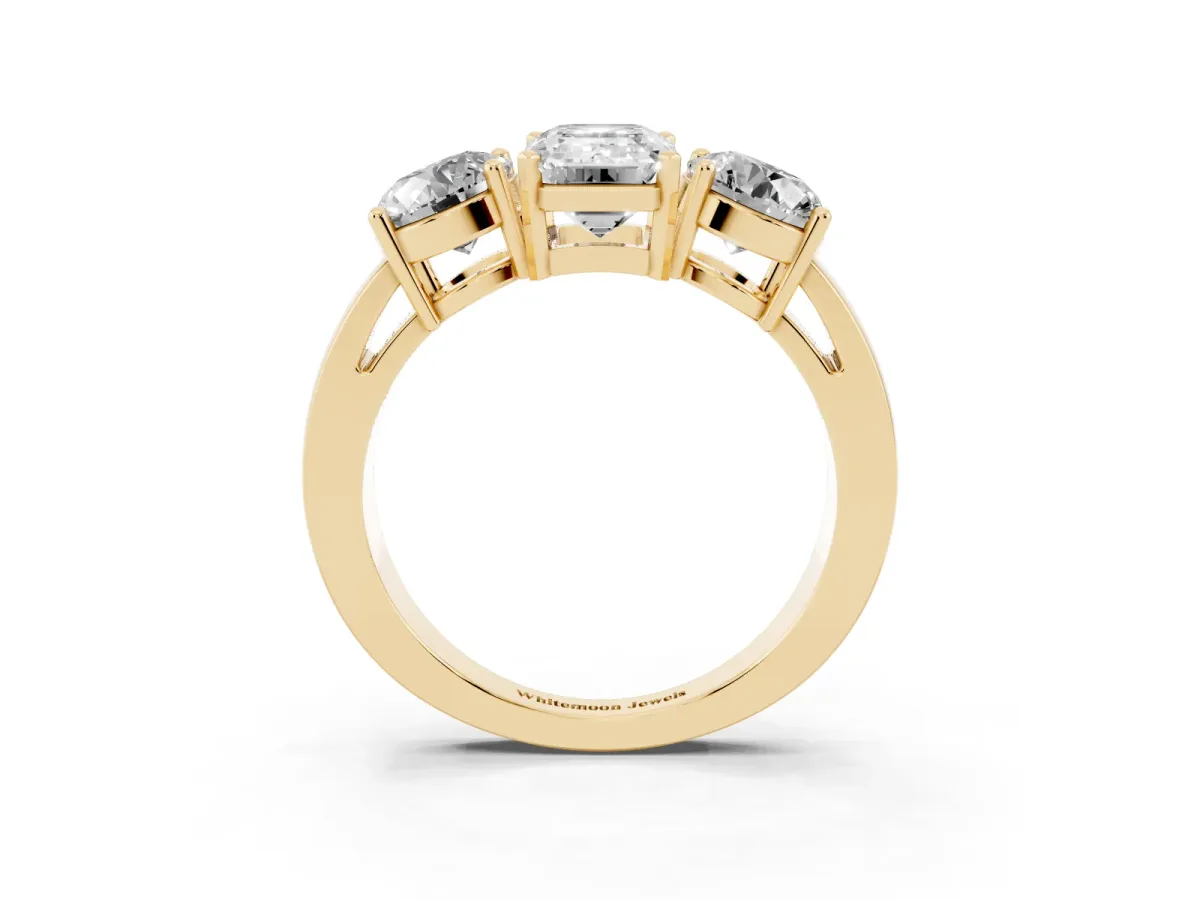 Three-Stone Emerald Cut Diamond Ring with Round Side Stones, Classic Band, and Four-Prong Setting Yellow gold